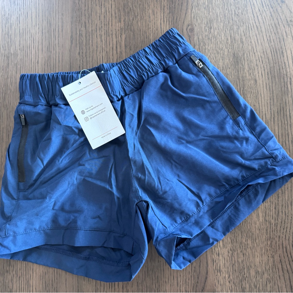 BRAND NEW Girls Size 8 (130) Blue Athletic Shorts with zipper pockets
